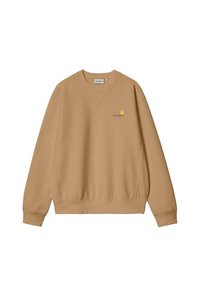 Sudadera color beige con mangas largas y cuello redondo. Presenta un pequeño logo amarillo en el pecho y una cintura de canalé. Textura suave.