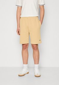 Lacoste - LIFESTYLE   - Pantaloni de trening - beige Imagine miniatură 1