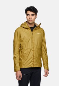 Yellow lightweight jacket with a hood, featuring a front zipper, two side pockets, and a contrasting textured inner lining. Logo displayed on chest.