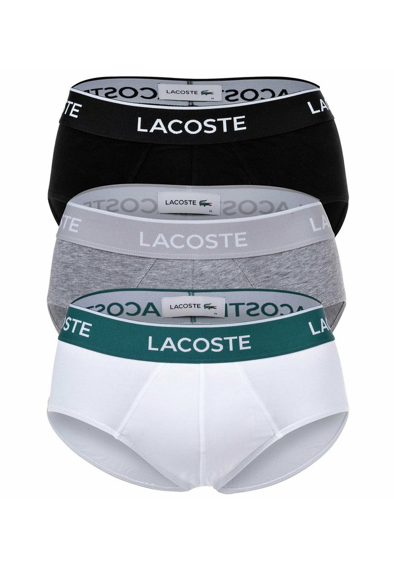 Ensemble de sous-vêtements pour hommes Lacoste en trois couleurs : noir, gris et blanc. Chacun dispose d'une ceinture élastique avec logo et d'un tissu en coton pour le confort.