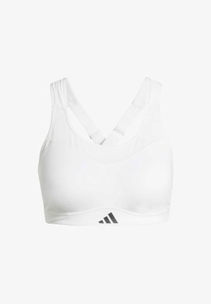 Sujetador deportivo blanco con un escote redondeado, tirantes gruesos cruzados en la parte posterior y un logo gris de Adidas en la esquina inferior izquierda. Textura de tela suave.