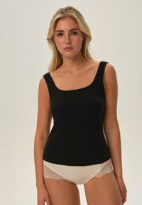 Black sleeveless tank top with a square neckline, made from ribbed fabric, paired with beige panties featuring lace detailing along the edges.