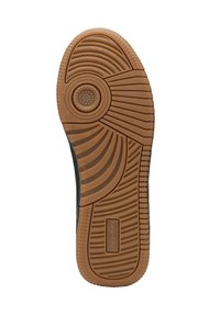 Schwarze Schuhsohle mit einer strukturierten Gummioberfläche, die ein kreisförmiges Muster, konturierte Rillen und eine sandfarbene Profilierung mit einem Logodetail aufweist.