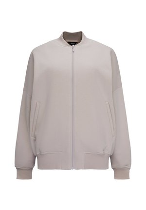 Jasbeżowa bomberka z zamkiem z przodu, ściągaczami przy mankietach i dolnej krawędzi oraz bocznymi kieszeniami; wykonana z miękkiego, teksturowanego materiału.