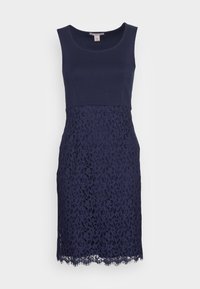 Robe sans manches bleu marine avec un corsage uni et une jupe en dentelle florale se terminant juste au-dessus des genoux, dotée d'un col rond.