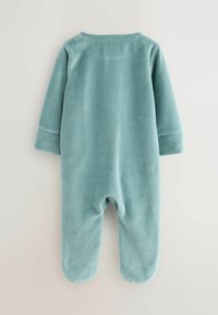 Rompere per neonati a maniche lunghe di colore blu chiaro, con piedi integrati, mostrato da dietro su uno sfondo neutro.