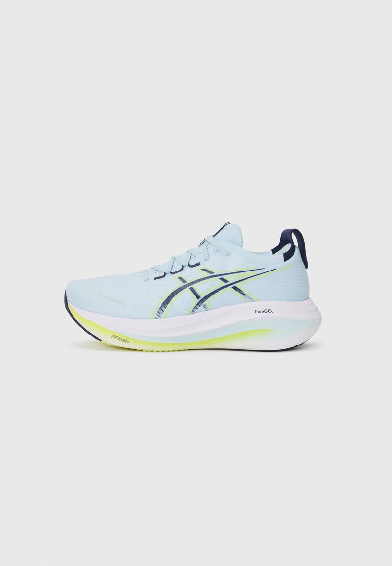 Light blue athletic shoe with a textured upper, reinforced sides, white midsole, and a bright yellow-green accent on the outsole.