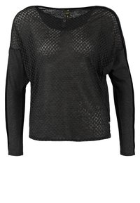 Haut noir à manches longues en tissu texturé et à motifs, avec un décolleté en forme de scoop, comprenant un détail de bouton à l'avant et des rayures contrastantes sur les côtés.