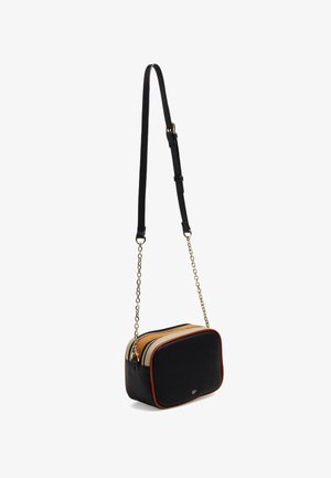Black leather crossbody bag with a rectangular shape, featuring a gold chain strap, orange and beige accents, and double zipper closure.