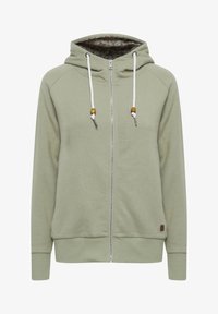 Sudadera con capucha de color verde claro con cremallera, cordones blancos con cuentas de madera, puños y dobladillo acanalados, y forro interior de la capucha con estampado.