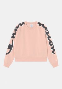 Felpa rosa con scollo rotondo e maniche raglan. Presenta dettagli grafici in bianco e nero sulle maniche e sul petto. Tessuto morbido.