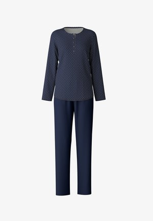 Marineblauwe lounge set met een lange mouw top met witte stippen en een henley halslijn, gecombineerd met effen marineblauwe broeken.