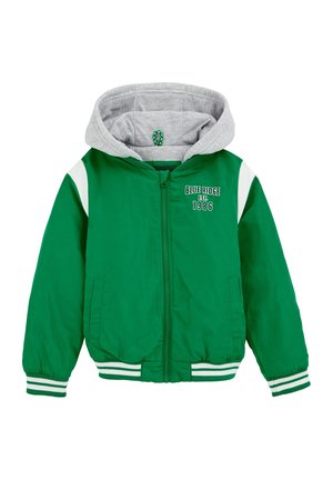 Zielona kurtka zapinana na zamek z szarym kapturem, białymi akcentami i ściągaczami. Na przodzie znajduje się napis "BLUE RIDGE EST. 1986". Gładka tekstura.