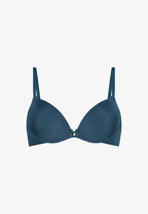 Soutien-gorge à armatures rembourré teal avec bretelles réglables. Présente un nœud central et un éclat subtil sur un tissu lisse. Design doux et galbé.