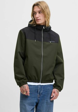 Green and black hooded jacket with a zip front, elastic cuffs, and hem, featuring a logo on the chest and smooth, textured fabric.