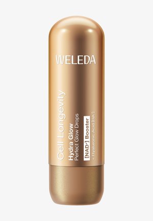 Sérum facial Weleda Cell Longevity Hydra Glow dans un flacon métallique doré en forme de capsule avec des détails du produit sur le devant.