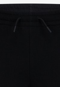 Jordan BROOKLYN ESSENTIALS PANT - Pantalones deportivos - black