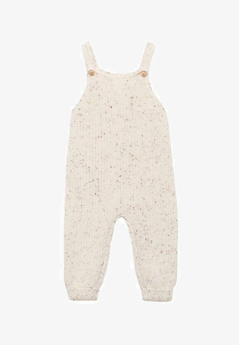 Pahuljasti traperice boje kreme s mrljastim naglascima, sa podesivim trakama, dva drvena gumba i rebrastim čizmama.