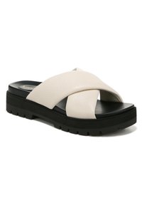 Witte leren slide sandaal met een kruisvormig ontwerp van overlappende banden en een dikke zwarte platformzool met een gestructureerde grip.