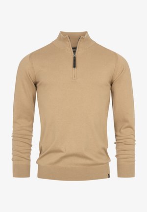Beige zip-neck sweater with long sleeves, made of soft fabric, featuring ribbed cuffs and hem, and a small logo label at the bottom.