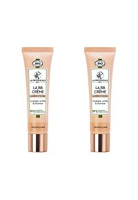 Deux tubes de crème BB, de couleur beige clair, avec des étiquettes blanches et vertes. Les tubes présentent des accents dorés à la base et une texture lisse.