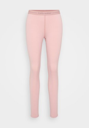 Lyse rosa leggings laget av myk stoff, med et ensfarget design og en kontrasterende midjebånd med merkevarenavnet "icebreaker" trykt.