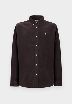 Dark brown corduroy shirt with a button-down collar, long sleeves, white buttons, and a small logo on the left chest.