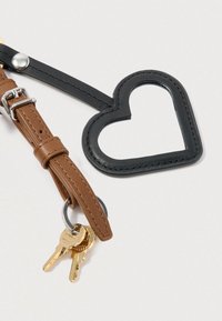 Keychain with a brown leather strap and a black heart-shaped holder. Includes a keyring with two golden keys attached.