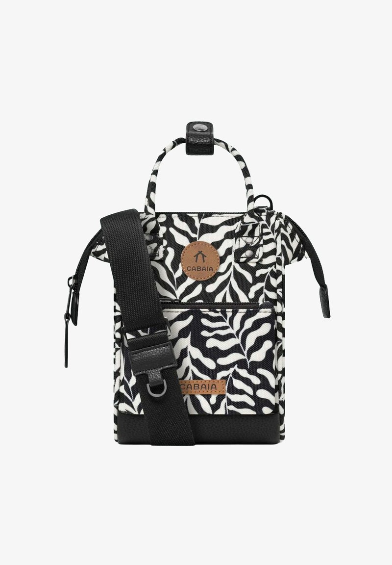 Black and white zebra-patterned fabric bag with a leather base, adjustable strap, top handles, and a prominent logo patch.