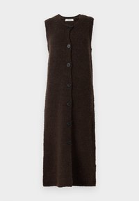 Lang, ermeløs, mørkebrunt vest med en strukturert stoff og svarte knapper foran. Enkel, rettsnittet design.