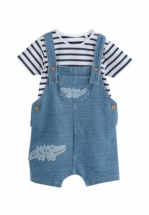 Denim overall srajca z modrimi in belimi črtami iz bombaža. Ima izvezen detajl krokodila in lesene gumbe na naramnicah.