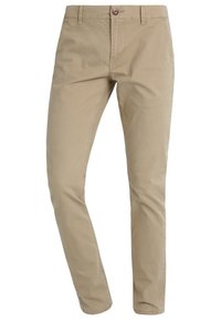 Beżowe bawełniane chinosy o prostym kroju, zapinane na guziki, z szlufkami na pasek i bocznymi kieszeniami. Gładka faktura z subtelnymi detalami przeszyć.