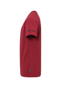 Rode katoenen T-shirt met korte mouwen, voorzien van een zwart "uhlsport" logo op de linkermouw. Rechthoekige snit en zachte textuur.