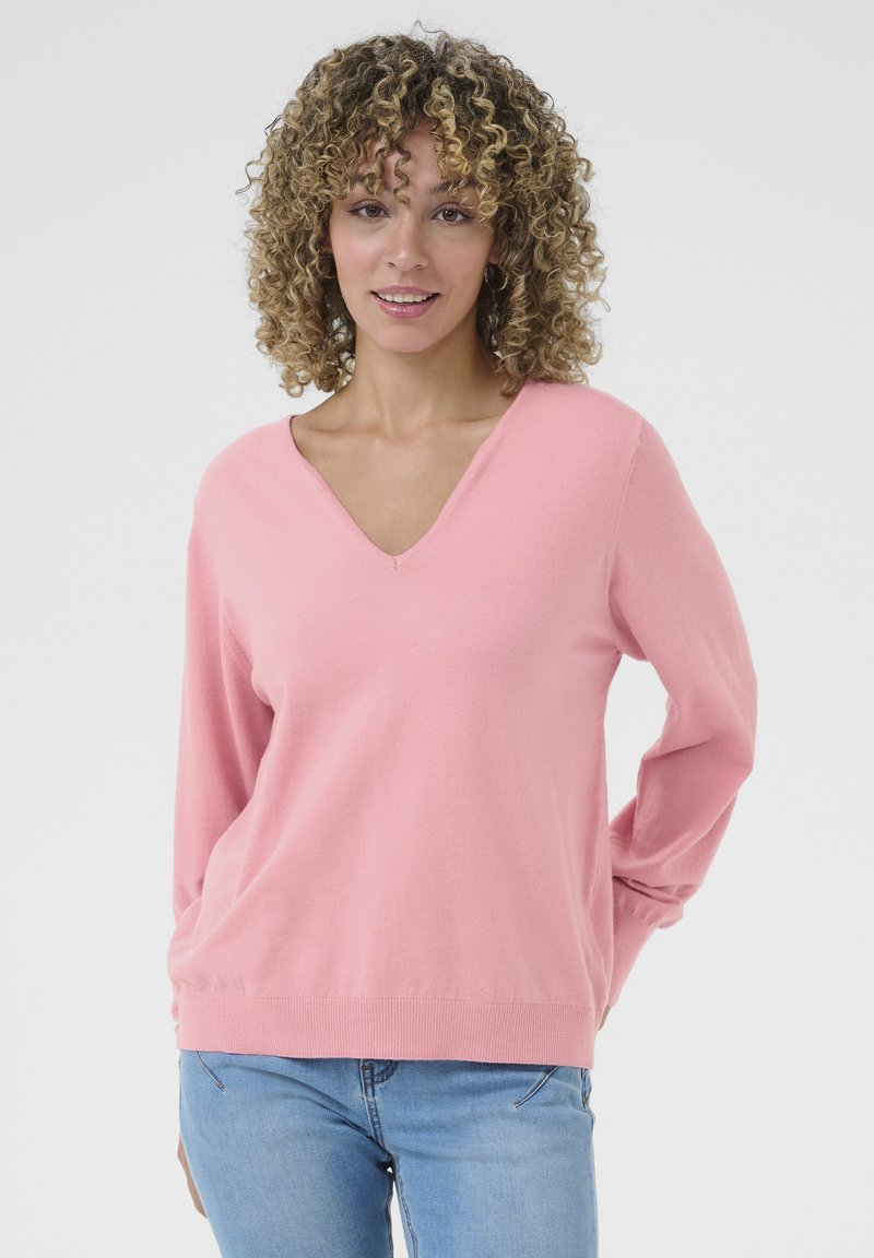 Maglione rosa chiaro a V con maniche lunghe, realizzato in un materiale morbido, caratterizzato da una vestibilità comoda e un orlo a coste.