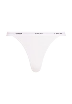 Witte Calvin Klein string van ribgebreid materiaal, met een smalle elastische tailleband met logo detail, minimalistische bedekking ontwerp.