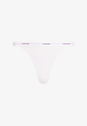 Perizoma bianco Calvin Klein realizzato in tessuto a coste, con un stretto elastico in vita decorato con il logo e un design a copertura minima.