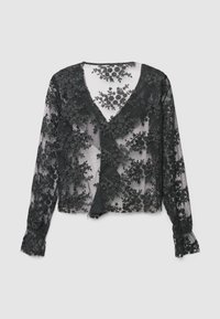 Blusa in pizzo nero con motivo floreale, scollo a V e maniche lunghe. Tessuto trasparente con ricamo strutturato e polsini arricciati.