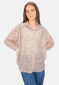 Lightweight, sheer button-up shirt in a beige leopard print. Features a classic collar, drop sleeves, and a relaxed fit.