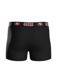 Mustat bokserialushousut, joissa on leveä vyötärönauha, jossa lukee punaisella ja valkoisella "49ERS" sekä logo, sileä kangas ja vartalonmyötäinen malli.