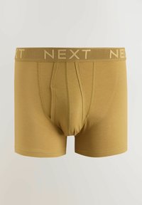 Boxeri galbeni din bumbac, cu design strâns, talie elastică cu logo-ul „NEXT” și textură netedă. Fără modele sau accente vizibile.