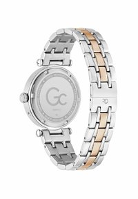 Srebrny zegarek ze stali nierdzewnej z bransoletą w dwóch kolorach, z polerowanymi złotymi akcentami, okrągłą kopertą i szafirowym tyłem.