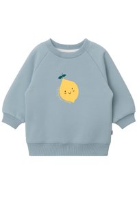 Hellblaues Sweatshirt mit Raglanärmel, ausgestattet mit einem gelben Cartoon-Zitronen-Graphic und Text darunter. Der Stoff sieht weich aus und hat einen gerippten Bund.