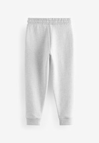 Graue Sweatpants aus weichem Stoff, mit elastischem Bund, schmal zulaufenden Beinen und gerippten Bündchen an den Knöcheln.