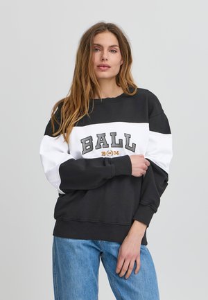 Sweatshirt bicolore noir et blanc avec un texte "BALL" en gros caractères, des poignets et un ourlet côtelés, fabriqué à partir d'un tissu doux, coupe décontractée.