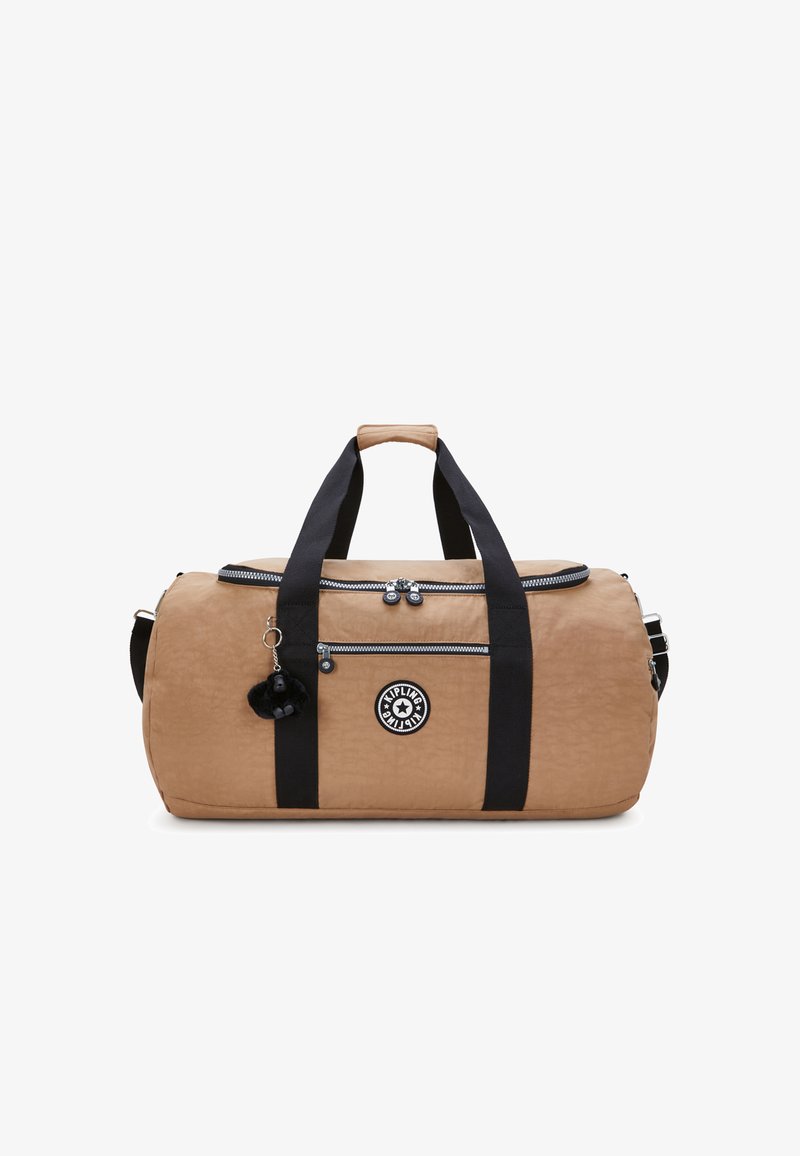 Brown duffel bag made of textured nylon with black straps, a zippered pocket, and a round logo patch. Includes a black fuzzy keychain.