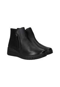 Bottines noires en cuir lisse et en daim. Elles possèdent une fermeture éclair sur le côté, un bout arrondi et une semelle en caoutchouc texturée pour une meilleure adhérence.