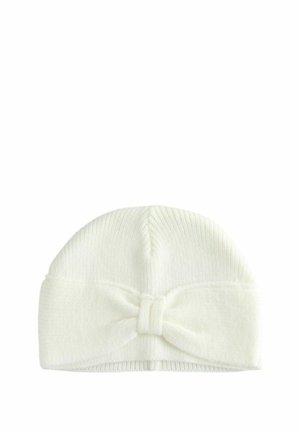 Knit white baby beanie with a ribbed texture, featuring a large bow detail at the front. Flexible and soft material.