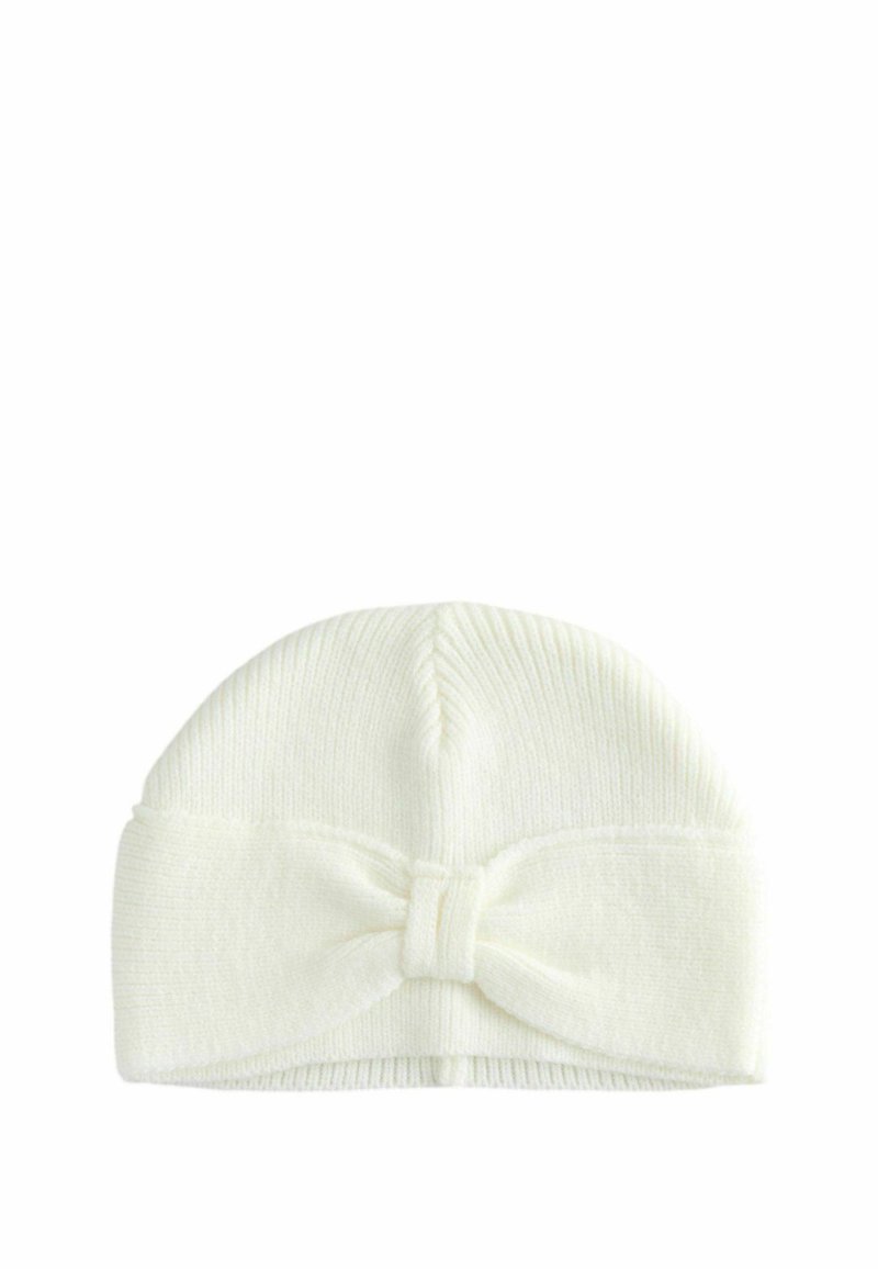 Knit white baby beanie with a ribbed texture, featuring a large bow detail at the front. Flexible and soft material.