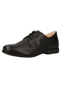 Chaussure oxford en cuir noir avec une texture lisse, bout arrondi, design à lacets et talon bas. Présente un style minimaliste avec des accents subtils.