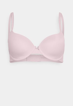 Sostenedor de pecho rosa claro con aros, copas lisas, correas ajustables y un cierre de gancho y ojal en la parte posterior. Presenta un pequeño detalle de moño en el centro.